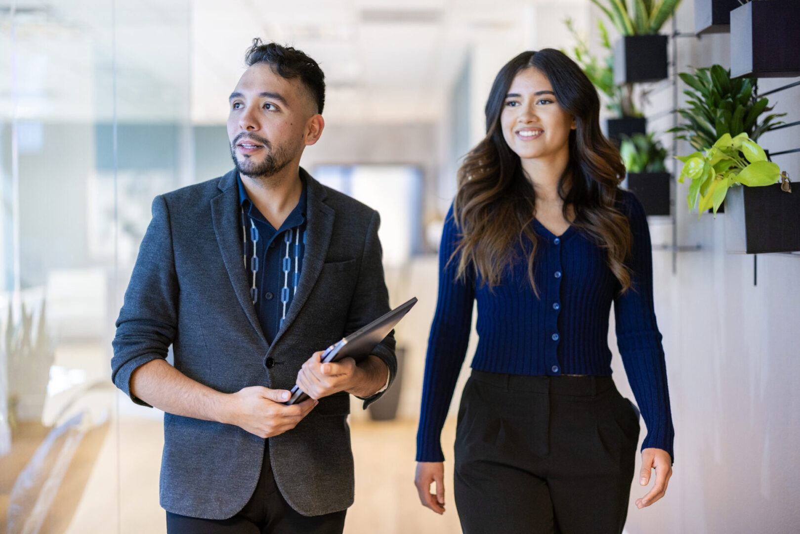A Hispanic office worker walking into to the job interview.